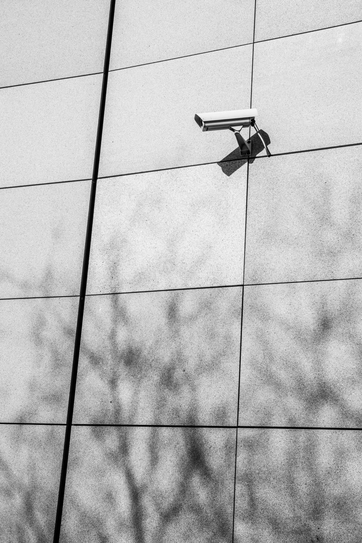 A surveillance camera installed on a modern building